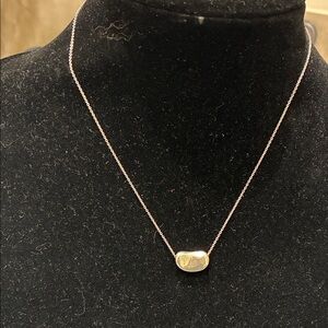 Elsa Peretti® Bean® Design pendant necklace  by Tiffany & Co.. 👝